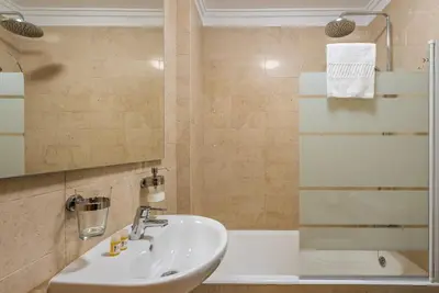 a bathroom with a sink and a shower at GuestReady - Charming Cozy Getaway in Porto in Porto
