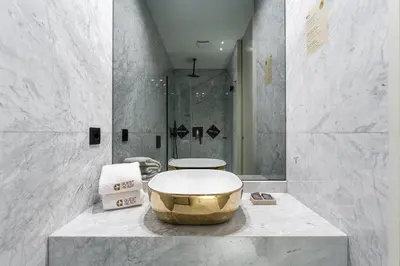 a bathroom with a large tub on a marble counter at GuestReady - Alma Invicta in Porto