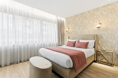 a bedroom with a large bed with red pillows at GuestReady - Alma Invicta in Porto