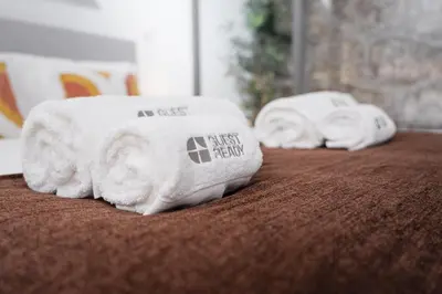 two towels sitting on top of a bed at GuestReady - Relaxing getaway in Santos Pousada in Porto