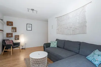 a living room with a couch and a table at GuestReady - Relaxing getaway in Santos Pousada in Porto