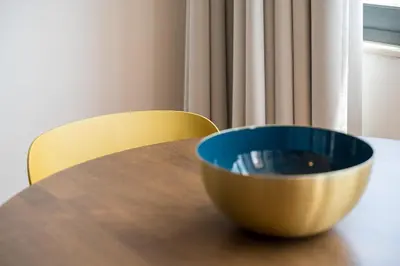 a bowl sitting on top of a wooden table at GuestReady - Blissful escape in Porto in Porto