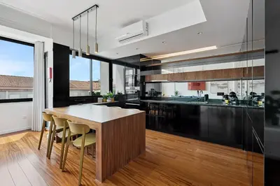 a kitchen with a wooden table and a counter top at GuestReady - Blissful escape in Porto in Porto