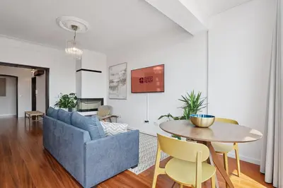 a living room with a blue couch and a table at GuestReady - Blissful escape in Porto in Porto