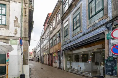 an empty city street with a bunch of buildings at Microloft in the heart of Porto in Porto