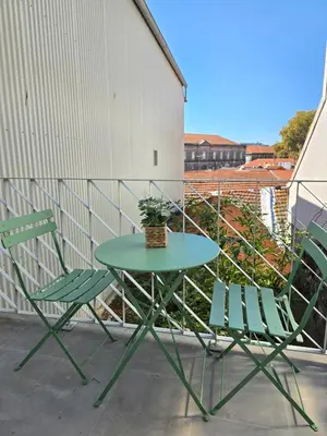 a bedroom with a bed with two towels on it at Le Bourgeois in Porto