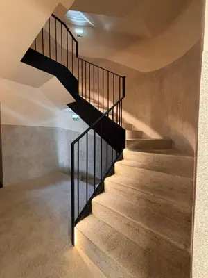 a staircase in a house with black railings at Porto - Boavista Casa Da Música- Art Gallery Apartment III in Porto