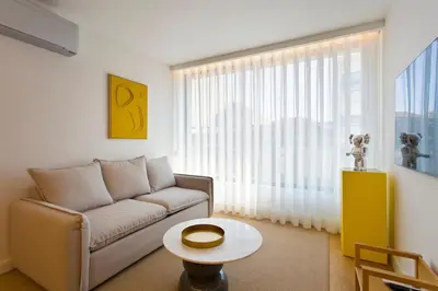 a living room with a couch and a table at Porto- Boavista Casa Da Música - Art Gallery Apartment II in Porto