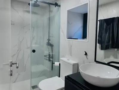 a bathroom with a shower and a sink and a toilet at Casa dos Moinhos - Country House in Porto City in Porto