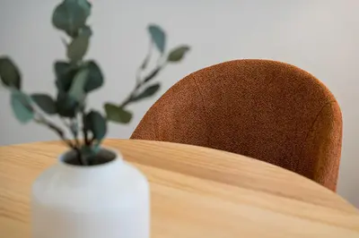 a wooden table with a white vase on top of it at GuestReady - Marble Root in Porto