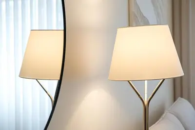 two lamps in front of a mirror in a hotel room at GuestReady - Marble Root in Porto