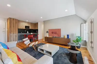 a living room with a couch and a table at GuestReady - Cheerful place in Porto in Porto