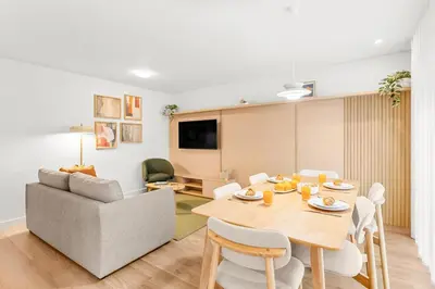 a dining room with a table with food on it at Urban Comfort @ Bonfim Boutique Flats in Porto