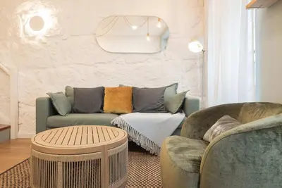 a living room with a couch and two chairs at Liiiving in Porto - Downtown Comfort House in Porto