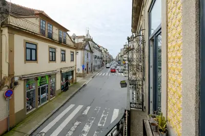 a view of a street from a window of a building at Bright 2bedroom apartment in Bonfim, 2 minutes from Campanhã, Porto city center in Porto