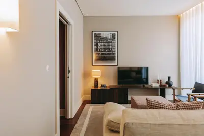 a living room with a couch and a television at Gran Cruz Apartments in Vila Nova de Gaia