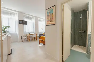 a bathroom with a walk in shower in a room at Downtown Formosa Studio by Vacationy in Porto