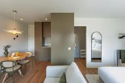 a living room with a couch and a table at Bom Sucesso Executive Flats by Feel Porto in Porto