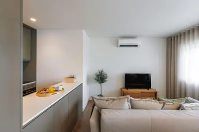 a living room with a couch and a table at Bom Sucesso Executive Flats by Feel Porto in Porto