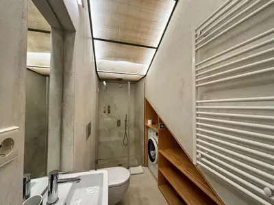 a bathroom with a toilet and a sink and a shower at Paraíso Garden Apartments in Porto
