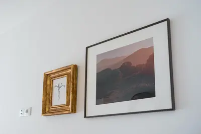 two pictures on a wall next to each other at Historic Porto Flat, Central Porto in Porto