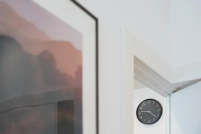 a clock on a wall next to a window at Historic Porto Flat, Central Porto in Porto