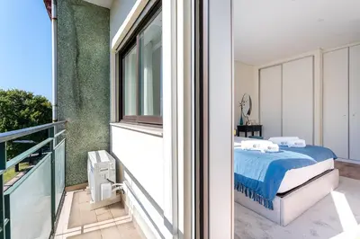 a bedroom with a large white bed with two lamps at GuestReady - Charming retreat in Porto in Porto