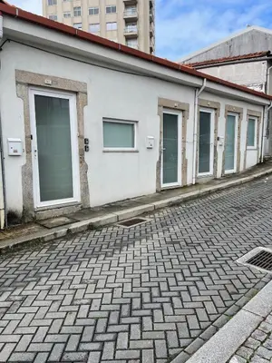 a row of windows on the side of a building at Antas Place B in Porto