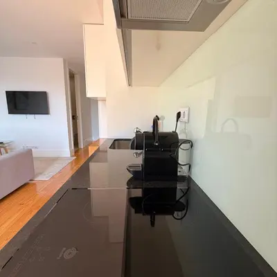a bathroom with a shower and a toilet and a sink at Flores Street Apartment - Porto City Center in Porto