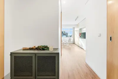 a view of the hallway from the living room into the dining room at GuestReady - Urban comfort in Boavista in Porto
