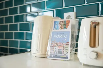 a bathroom counter with a toaster and a book on it at GuestReady - Urban comfort in Boavista in Porto