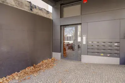 an external view of a building with a glass door at Trindade Skyline Premium by Hosty in Porto