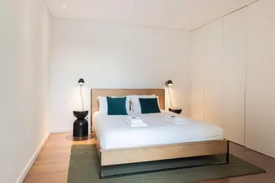 a kitchen with a table and chairs in a room at Liiiving in Porto - The Prestige Apartment C in Porto