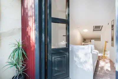 a room with a door and two potted plants at GuestReady - charming retreat in Porto in Porto