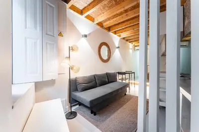 a living room with a couch and a table at GuestReady - charming retreat in Porto in Porto
