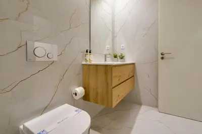 a white bathroom with a toilet and a sink at Luxury Style 8 with AC Downtown Porto near Metro in Porto