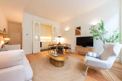 a living room with a couch and a table at Almada 559 - Eça Atelier by Lisbeyond in Porto