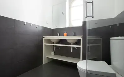 a bathroom with a sink and a toilet at Best Guest Porto Hostel in Porto