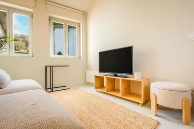 a bedroom with a bed in a room at The Riverside House in Porto