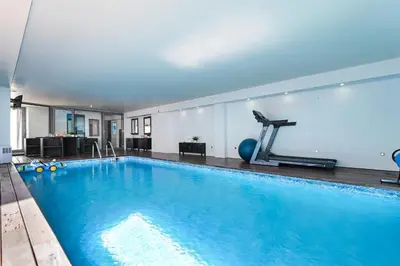 a living room with two couches and a table at Luxury House by ON Apartments in Porto
