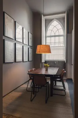 a dining room with a table and chairs and a window at Condes de Azevedo Palace Apartments in Porto