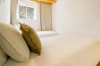 a bedroom with two beds and a window at Porto Covelo Park Apartment in Porto