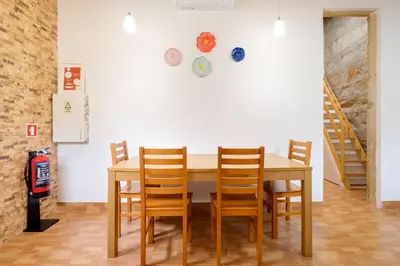 a dining room with a wooden table and chairs at Porto Covelo Park Apartment in Porto