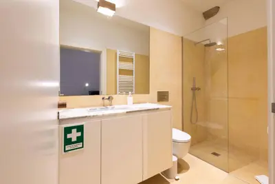 a bathroom with a sink and a toilet and a shower at Riverfront Heritage House in Vila Nova de Gaia