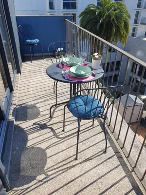 a table and chairs sitting on a balcony at Bonjardim Bright Studio in Porto