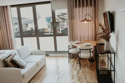 a living room with a white couch and a table at Bolhão Downtown in Porto