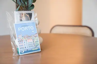 a book sitting on top of a table with a vase at GuestReady - Crown Garden Escape in Porto