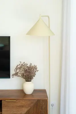 a lamp on top of a dresser with a vase on it at The Luminous by Lovely Memories - Pool Access in Porto