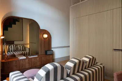 a living room with two chairs and a mirror at Aliados 9 - Luxury in the Heart of Porto in Porto