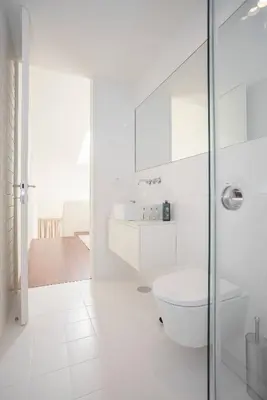 a white bathroom with a toilet and a sink at Liiiving in Porto - Luxury Gallery Apartment I in Porto